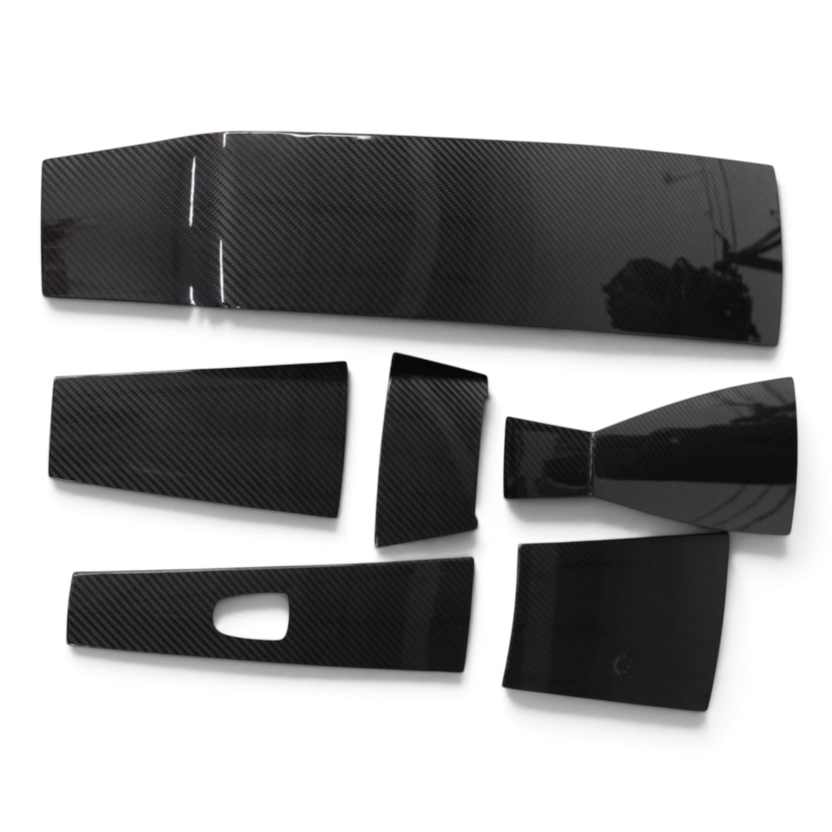 Mercury Racing carbon cowling trim set showing all six covers laid flat on a white background